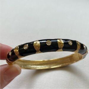 Black enamel hinged bangle with gold and rhinestone detail